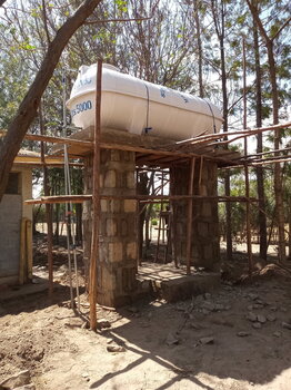 Photo of construction of 2 m elevated masonry reservoir stand with Installation of existing 5m3 fibre glass water tank at Makabasa Health Center